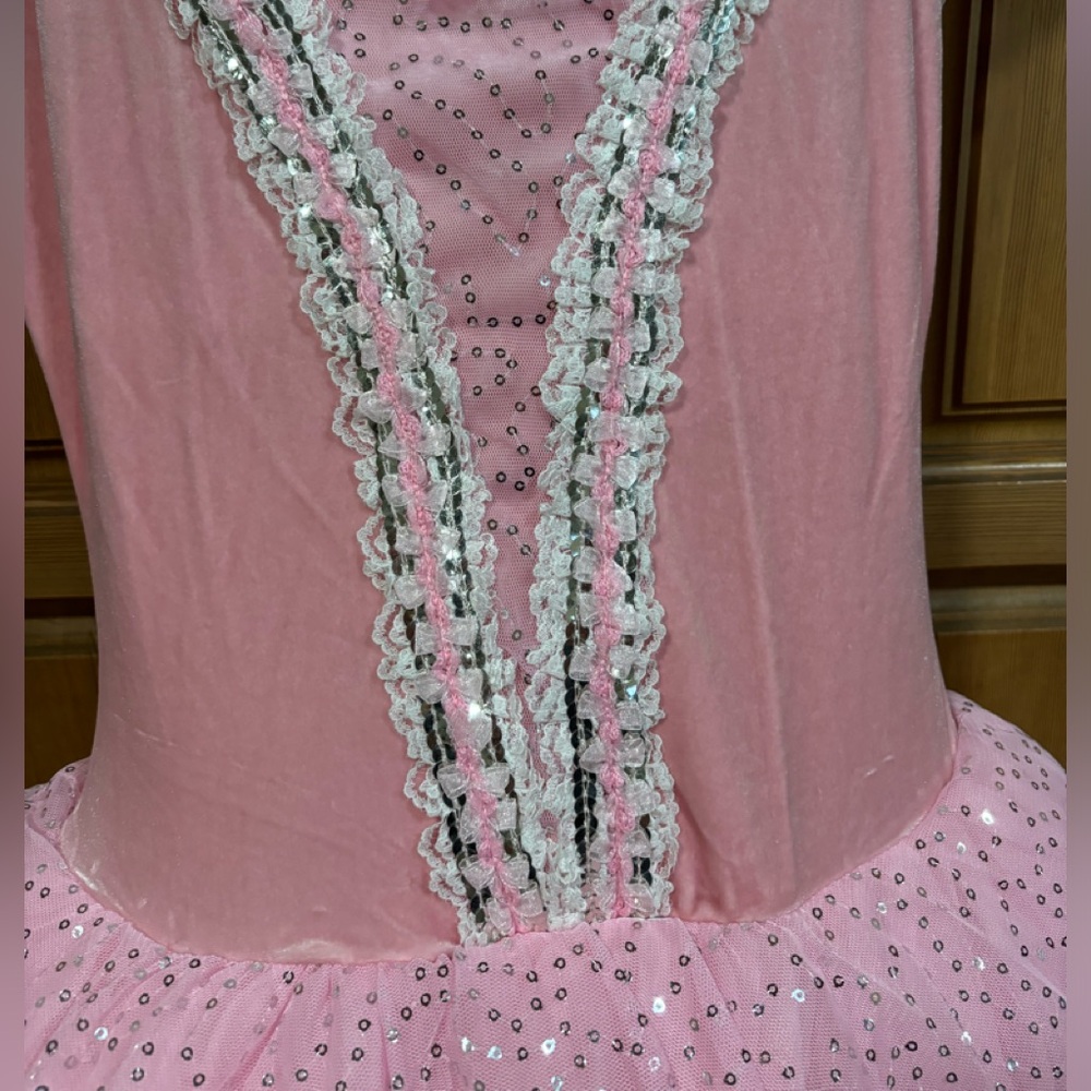 Pink velvet top with sequin skirt. Cap sleeves.